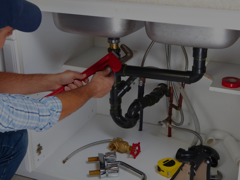 We Can Fix It All handyman providing Emergency Plumbing services, repairing a burst pipe in a residential home.