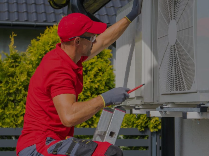 We Can Fix It All handyman conducting HVAC Repair and Maintenance on an outdoor unit to restore efficient home cooling.